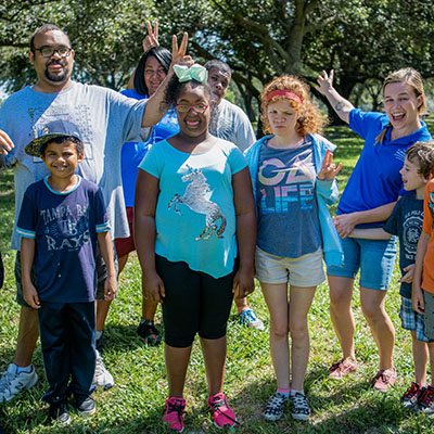 Participants in Camp Red Bird posing for a photo in Azalea Park.